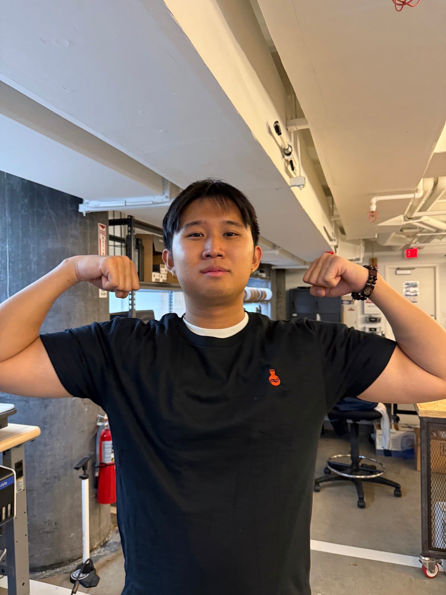 Jason flexing in a Plaza t-shirt