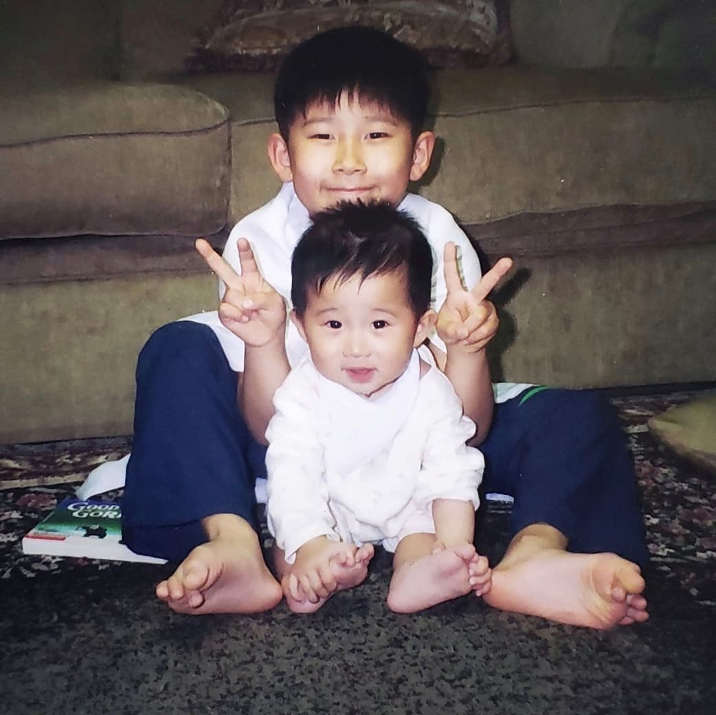 Baby photos of Jason with his sibling
