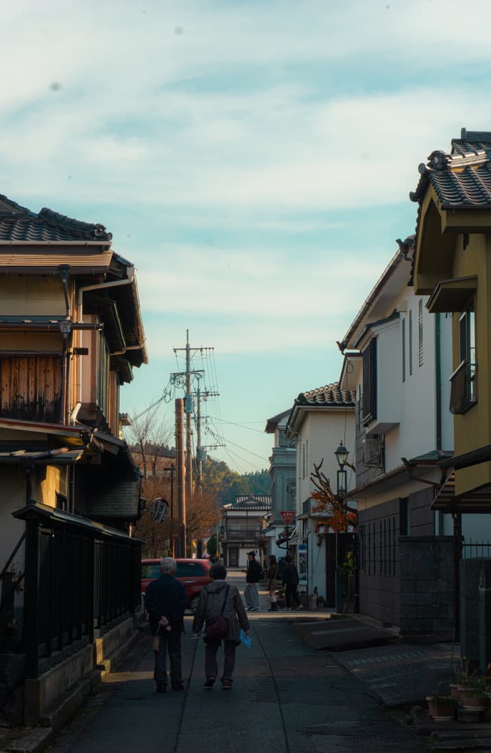 A quiet residential street lined with old wooden houses